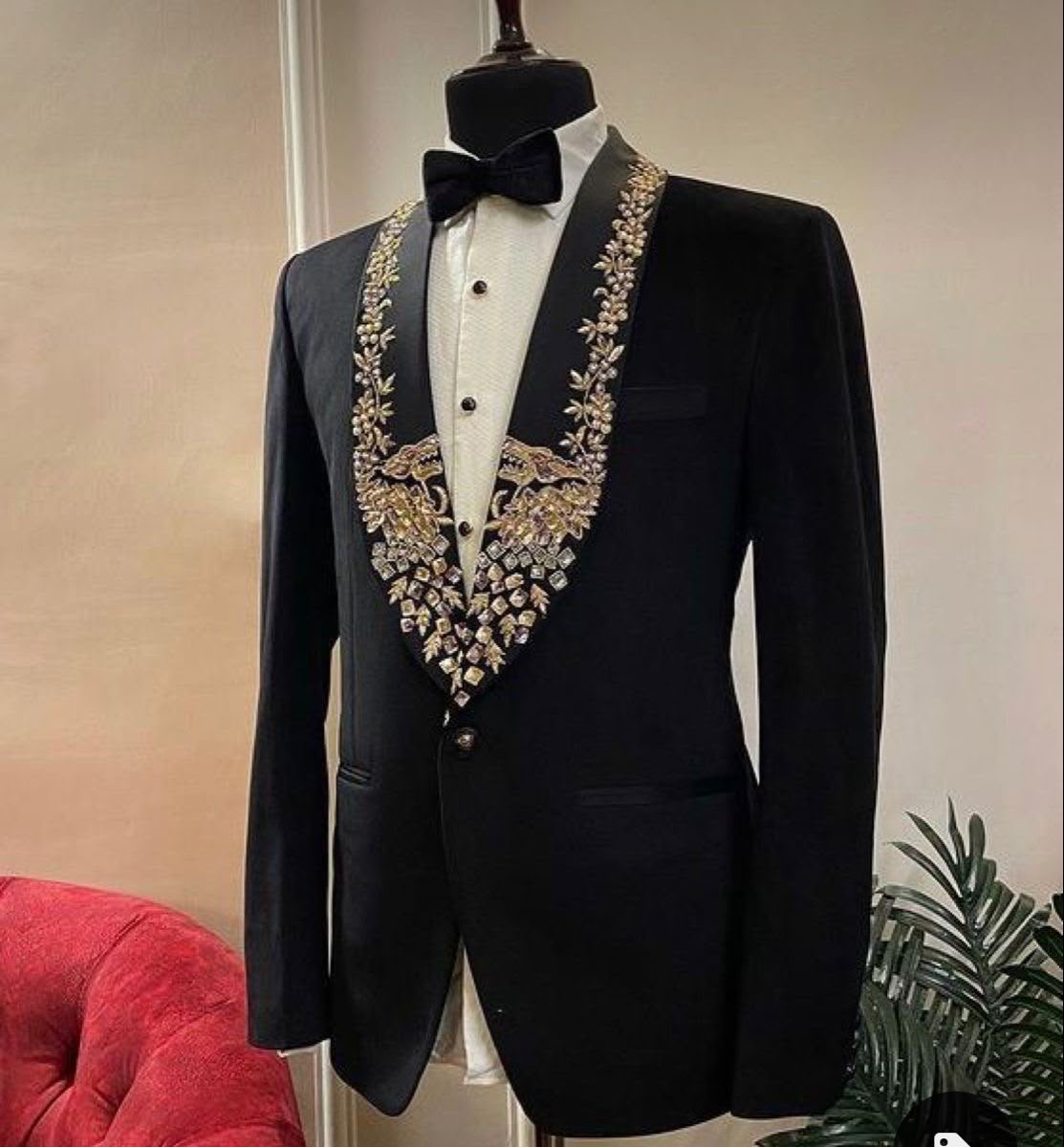 Embroidered Groom Suit. A black groom's suit with ornate embroidery for a memorable day.